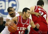Georgia Tech G Miller fights his way through a screen to stay with N.C. State G Javier Gonzalez