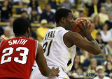 Jackets F Lawal gets ready to pivot on Wolfpack F Smith