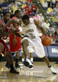 Georgia Tech F Lawal puts his head down and drives past N.C. State F Kendall Smith