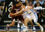 Virginia Tech F A.D. Vassallo protects the ball from a steal attempt by Carolina G Frasor
