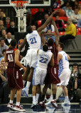 Tar Heels F Thompson blocks a shot by Hokies F Allen