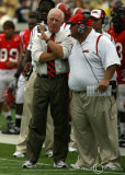 Jacksonville State Gamecocks Head Coach Jack Crowe discusses strategy with one of his coaches during the game