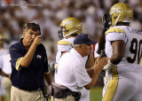 Georgia Tech Yellow Jackets Head Coach Paul Johnson directs a comment to T TJ Barnes as he comes off the field