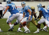 North Carolina QB T.J. Yates turns to go after an errant snap