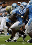 Yellow Jackets A-back Anthony Allen is gang tackled by Tar Heels defenders