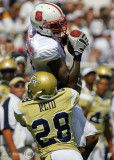 GT CB Rashaad Reid hits NC State WR Jarvis Williams as he makes a grab…