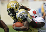 Tech B-back Anthony Allen struggles to gain yardage with an NC State defender on his back