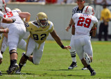 Yellow Jackets DE Jason Peters moves to stop Wolfpack HB Haynes