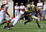 GT WR Daniel McKayhan has the ball knocked out of bounds by NC State DB Dontae Johnson after a catch and run