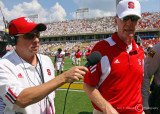 North Carolina State Head Coach Tom O’Brien is interviewed as he leaves the field