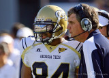 Georgia Tech Yellow Jackets Head Coach Paul Johnson sends a play in with WR Tyler Melton