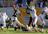 Yellow Jackets QB Washington throws over Canes DL Marcus Forston
