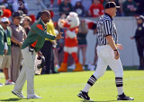 Miami Hurricanes Head Coach Randy Shannon has a discussion with the referee
