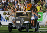 Georgia Tech Cheerleaders and Buzz ride the Ramblin’ Wreck onto the field before the second half kickoff