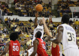 Jackets G Clinch passes over the Maryland defense