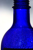Blue bottle with drops