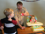 Dad offering Jimmy some cake