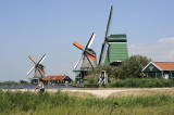 3 windmills, a river and a cyclist