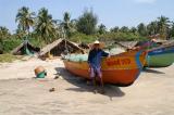 Fisherman and his boat at Morjim