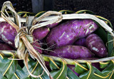 Purple potatoes in palm basket by John C.
