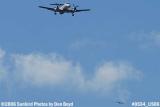 Gulfstream International EMB-120ER N261AS doing practice approaches with a turkey buzzard over Miami Lakes stock photo #0554