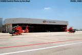 2006 - USCG HH-65 Dolphins and helo hangar at Coast Guard Air Station Miami military aviation stock photo #9283