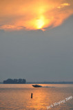 Boater on Grand Lake at sunset