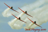 T6 Texans of the AeroShell Squadron perform over Oshkosh