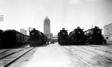 1927 or 1928 - four Florida East Coast Railway locomotives with the almost completed Dade County Courthouse in downtown Miami