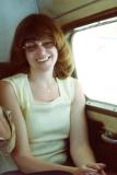 1976 - Jill Henderson Griffis in back of inflight chartered Aero Commander in 1976
