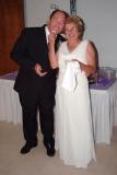 Pete and Linda after cake struggle, Pete with phony teeth inserted, photo #9057