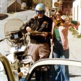 1975 - Brenda hamming it up with the trooper - she still got the speeding ticket