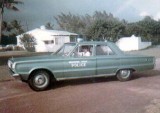 1968 - Officer Fred E. Daughtry Sr. in his Biscayne Park Police Department patrol car