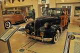1939 Pontiac Woody station wagon, photographed through glass window