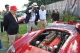 Fred Simeone, with red cap, looks at his 1958 Ferrari 250 Testa Rossa, built in late 1957 (5852)