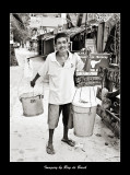 a taho vendor carrying a heavy load