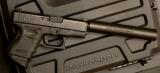 Glock model 26, 9mm with AWC Titanium Suppressor