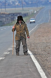 the blind person walking along a Siberian highway
