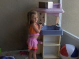 sophie in play kitchen