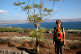 Judy at the Sea of Galilee with mountains in Jordan in the background.