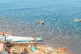 Judy floating in the Dead Sea - arms up in the air - impossible to sink because of the salt concentration.