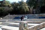 Two men playing chess close to the Mediterranean Sea - in Jaffa.  Part of Jaffas old city wall is in the background.