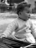 Richard circa 1944 - strapped into the carriage because he liked to climb out of it :-)
