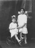 Aunt Peggy on a bicycle with aunt Rose - father's sisters (circa 1915)