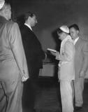 Richard - his bar mitzvah at Temple Agudath Sholom. Left to right: Grandpa Louis, rabbi Kravitz, Richard & his father (1955)