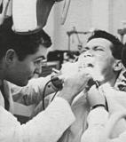 That's Richard on the left, a long time ago in a different profession. His patient obviously was having lots of fun. :-) (1966)