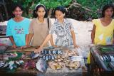 Poor - but always cheerful - people selling tiny fish