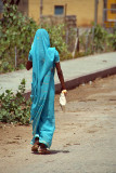 Woman in Sky-Blue Sari Walking Away