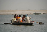 Family Being Rowed Across the Ganges