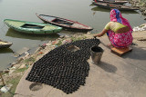 Woman Making Things by Ganges